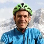 Mountain biking in South Tyrol © Hotel Pider Man with bike helmet in front of snowy mountains