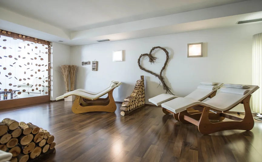 Relaxation room with modern lounge chairs and stacked wood decor