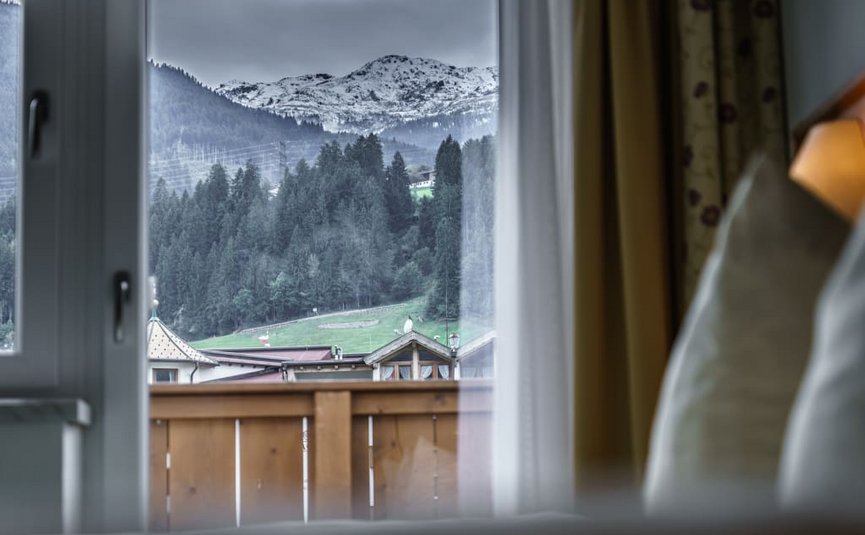 Bike week View through window of snowy mountain and forest