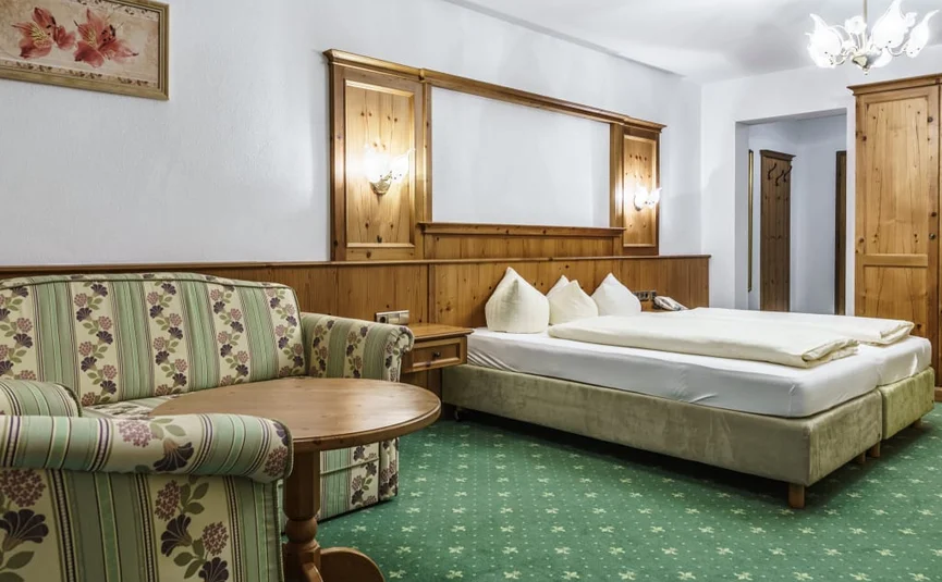 Bike week Cozy hotel room with double bed, sofa, and wooden furniture