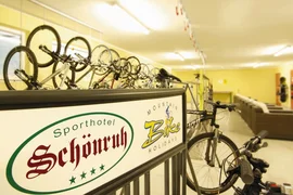 Bike rental area at Sporthotel Schönruh with several mountain bikes