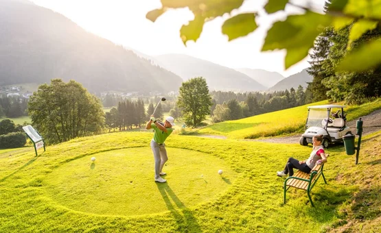 Golf days deluxe / 3 nights Golfer hitting ball on sunny mountain golf course