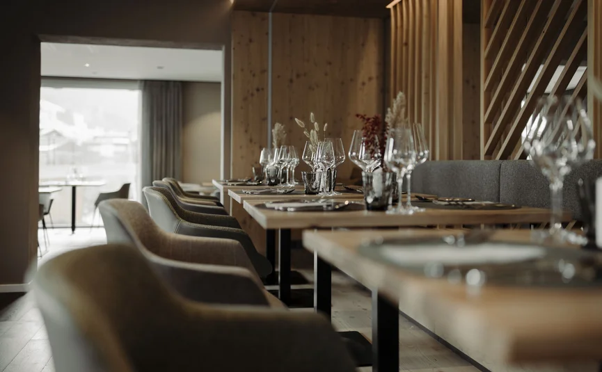 Elegant restaurant with set wooden tables and chairs