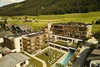 Collective enquiry © David Rasche Hotel complex with pool and sun loungers in green mountain landscape