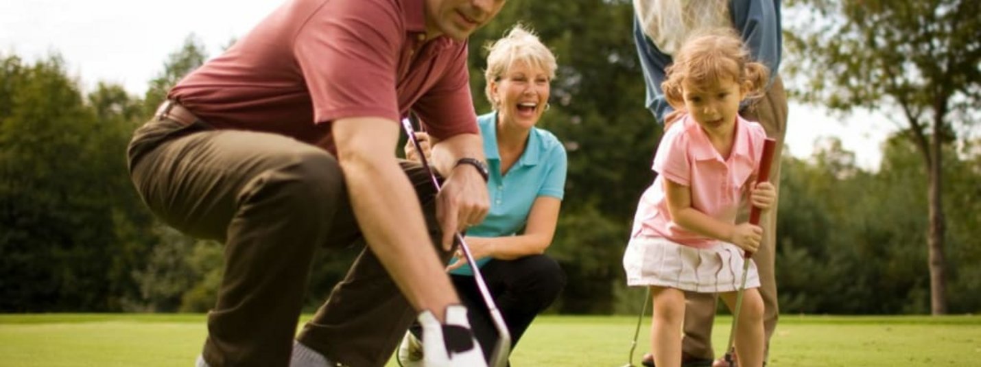 "Golf & Lake" UNLIMITED days Family playing golf on the green with a young girl and grandparents