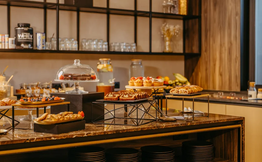 Buffet with pastries and cakes in a modern café