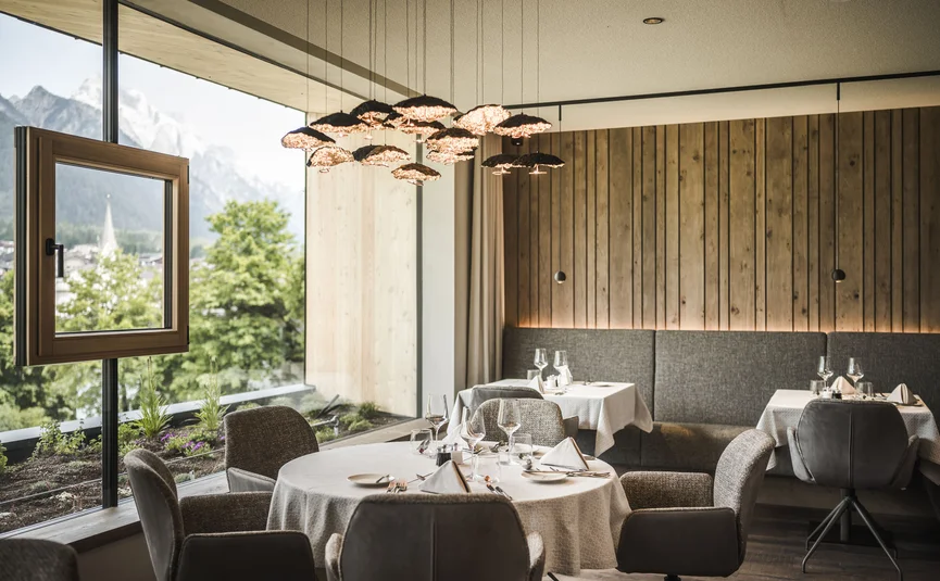 Elegant restaurant with large window and mountain view