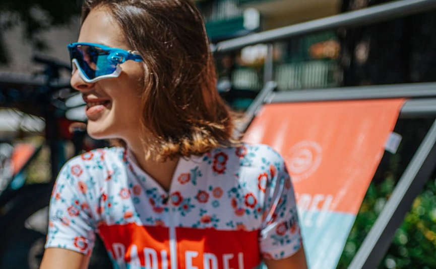 Ladylike Radmarathon Package - 2 nights Woman wearing colorful cycling jersey and sporty sunglasses