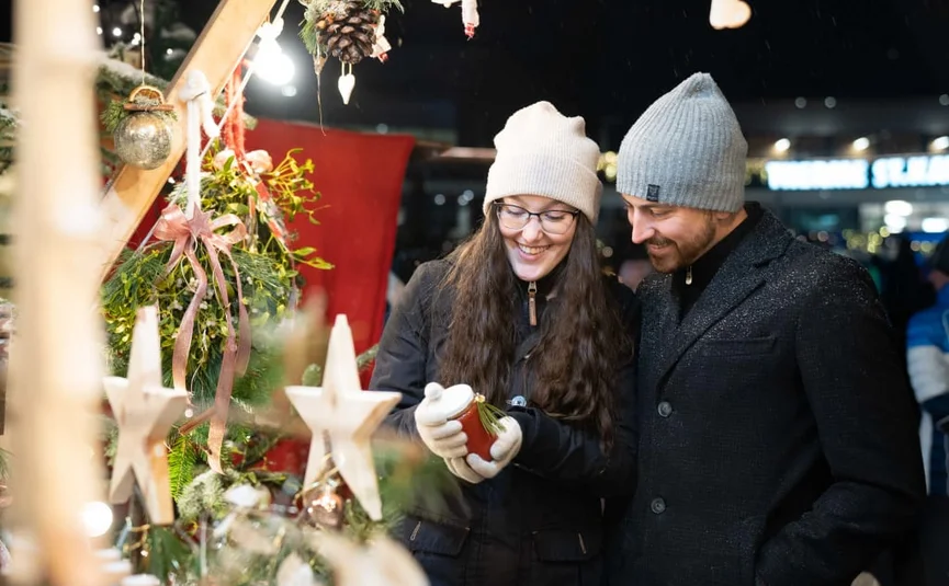 Advent season in "Kirchheim" 2 nights Couple looking at Christmas decoration at a festive market stall