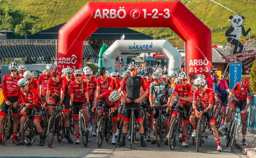ARBÖ Cycling Marathon 2026 – Road Bike Cyclists in red jerseys start a race under red and white inflatable arches