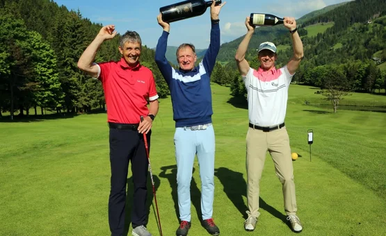 15. Charity Wine & Golf Cup / 4 nights Three men celebrating on golf course holding large wine bottles