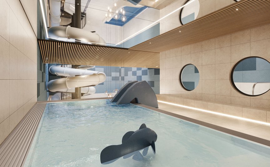 Indoor pool with water slide and children's splash area in modern spa